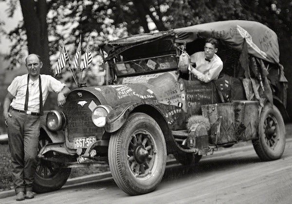 Jeff Davis, left, and his "rubber tramp" car with graffiti, including "Davis," "Keep Off," "Hobo King," "Hands Off," and "Traveling DeLux," in 1924. (From the Harris & Ewing Collection, Library of Congress)