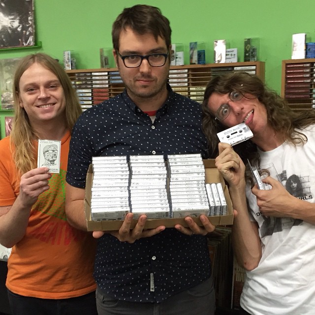 Sean Bohrman, left, with comedian and Nerdist co-host Jonah Ray, center, and Lee Rickard, right. Burger Records released Ray's second stand-up album, "Hello, Mr. Magic Plane Person, Hello," in collaboration with ASpecialThing Records. (Via the Burger Records Facebook page)