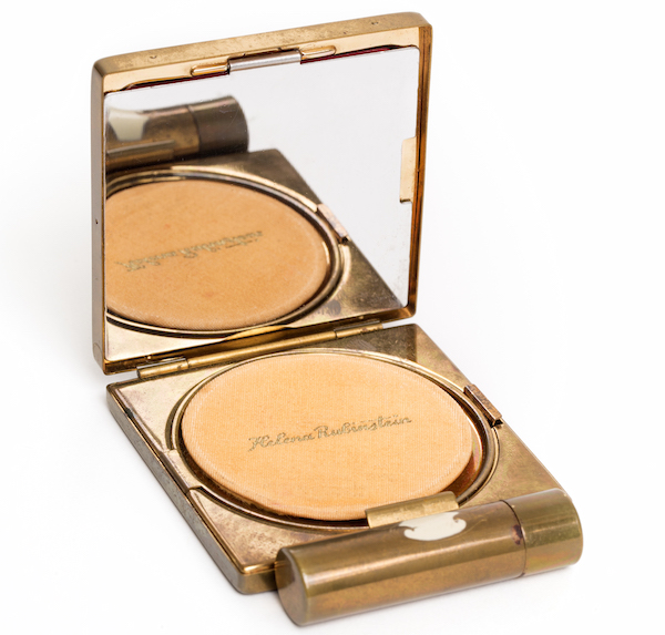 Top: Cosmetics magnate Helena Rubinstein always projected a scientific image. (Via Girlboss) Above: A vintage Helena Rubinstein compact in the Jewish Museum exhibition. (Photo by Bradford Robotham)