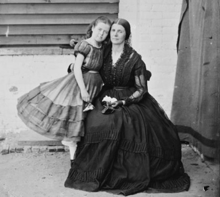 Confederate spy Rose O'Neal Greenhow, 48, and her 9-year-old child, Little Rose, in the courtyard of Old Capitol Prison in D.C., where she was being held on suspicion of treason in 1862. (From "Liar, Temptress, Soldier, Spy")