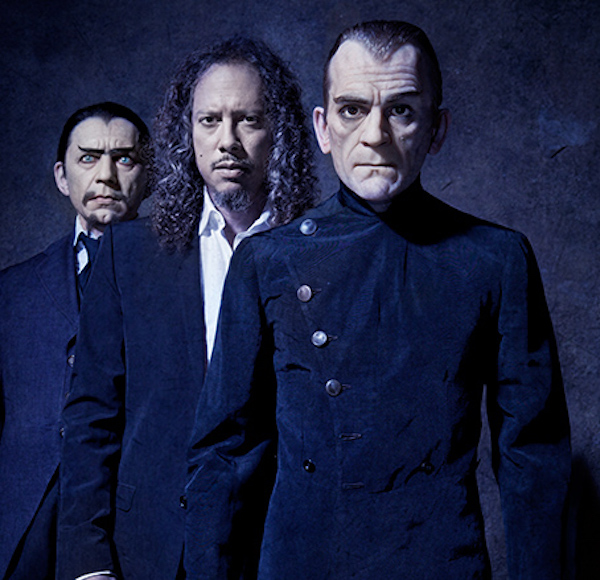 Hammett stands between a figure of Bela Lugosi, wearing the original vest and jacket from "White Zombie," and a mannequin of Boris Karloff wearing his outfit from "The Black Cat," a movie about a devil-worshipping architect loosely based on Aleister Crowley. (From "Too Much Horror Business")