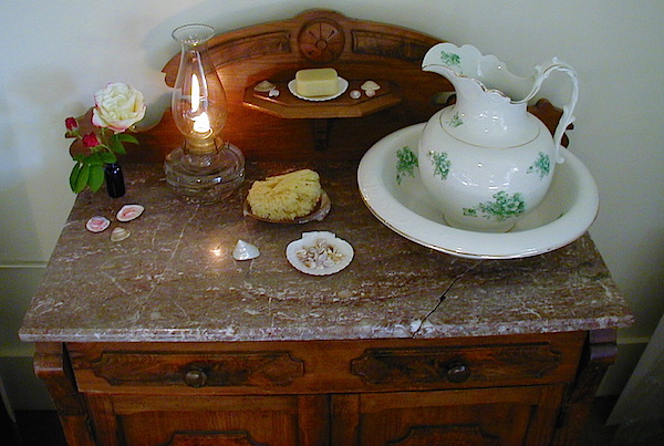For daily bathing, Sarah uses an antique ceramic bowl-and-pitcher set in her bedroom. (From ThisVictorianLife.com)