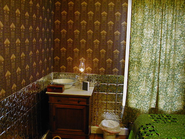 In the Victorian era, the Chrismans' home would have had wallpaper in every room. They've only been able to paper one room so far; the pattern, "Imperial Artichoke," is a replica of an 1893 wallpaper pattern. (From ThisVictorianLife.com)