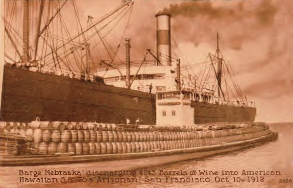 A barge of California wine barrels being loaded onto a cargo ship in San Francisco Bay, 1912. (Courtesy Gail Unzelman)