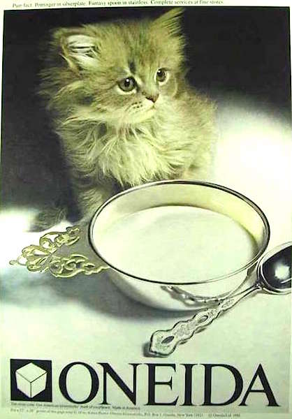 This 1981 Oneida Limited ad shows a kitten who's been served milk in a porringer with a "Fantasy"-pattern spoon.