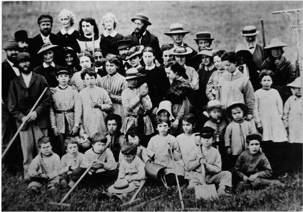 A group of Oneidans—men, women, and children—prepare to work together to clear the lawn. (From the Oneida Community Collection at Syracuse University Library in New York)