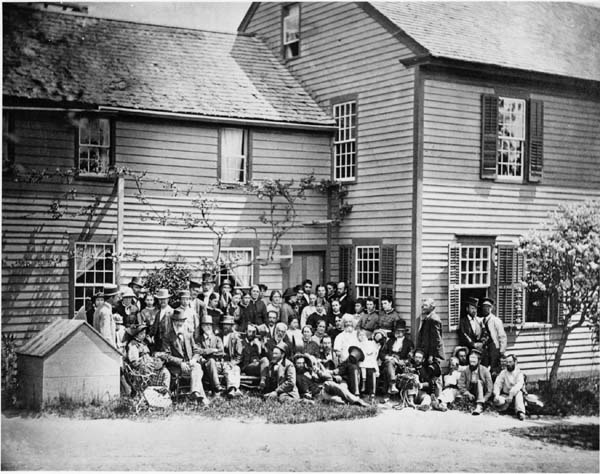 Members of the Wallingford, Connecticut, branch of the Oneida Community pose outside of their home in 1876. (From the Oneida Community Collection at Syracuse University Library in New York)