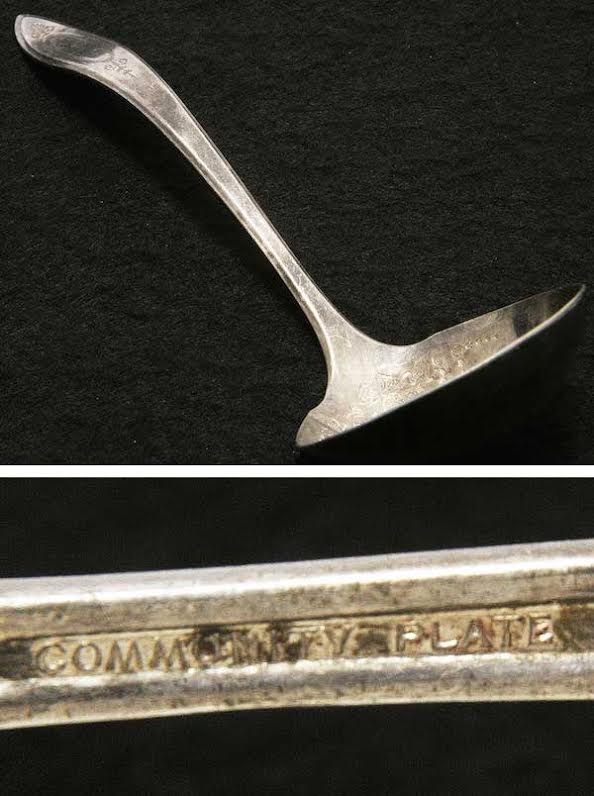 A 1917 Oneida silverplate ladle in the "Adam" pattern, marked "Community Plate."