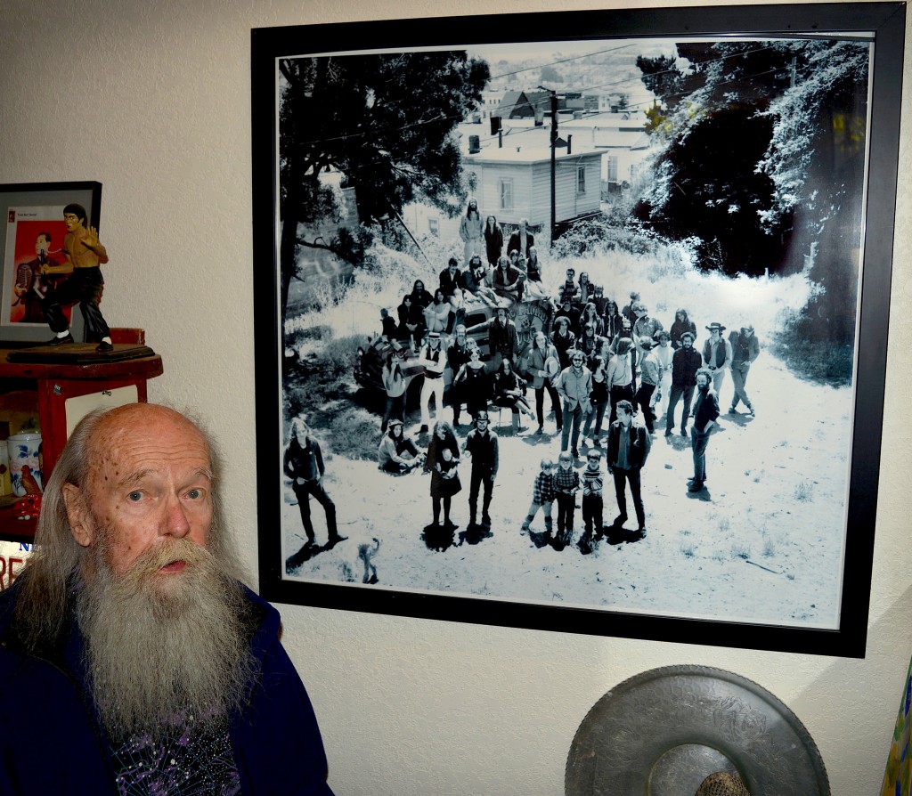 Top: A recent Bill Ham light painting from a studio session. Above: Bill Ham next to a Herb Greene photograph of the residents of Pine Street in 1966. The group—which includes members of Big Brother and the Holding Company, The Charlatans, and The Family Dog—are standing in the vacant lot between 2111 and 2115 Pine Street.