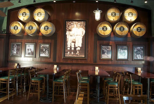 Hospitality Solutions designed the interior of Jake N Joes Sports Grille in Norwood, Massachusetts, using very select vintage photos of Boston sports teams. (Courtesy of Hospitality Solutions)