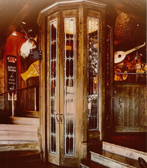 Behind the three-level phone booth in the San Bruno, California, Friday's—circa 1980—you see an explosion of antiques and memorabilia including vintage signs, taxidermy, and musical instruments. (Promotional photo, courtesy of Bob Treat)