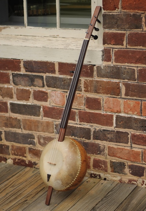 A contemporary gourd banjo by Pete Ross, based on traditional designs used by the Mande people of West Africa.