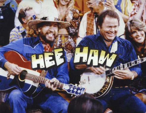 Buck Owens (left) and Roy Clark on the "Hee Haw" television show, circa 1975.