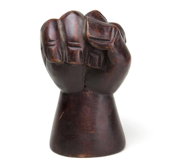 A wooden "clenched fist," circa 1965, appears in the exhibition, "All Power to the People: Black Panthers at 50." (Courtesy of the Oakland Museum of California)