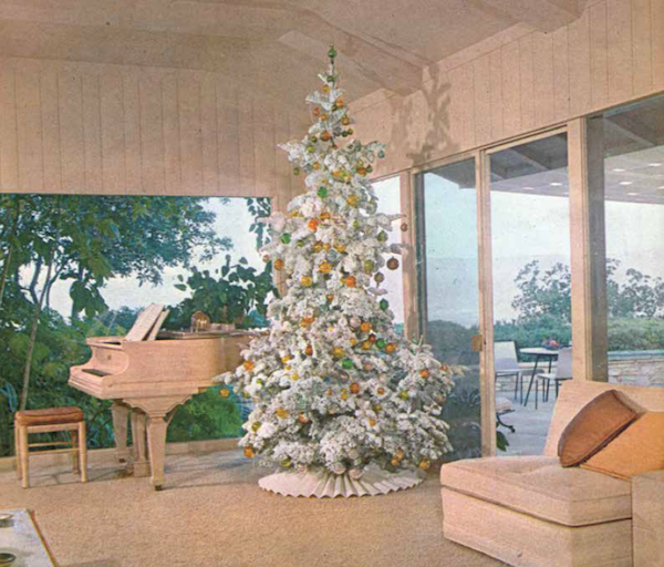The December 1961 "House Beautiful" featured a white Christmas tree in an elegant, beige Modernist room. (From Mid-Century Christmas, reprinted with permission of Hearst Communications, Inc.)