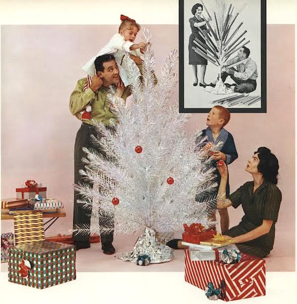 This image from a 1960 Alcoa Aluminum newsletter shows a family pulling the tubes off the branches of an aluminum tree and then decorating it with ornaments. Via Alcoa Records, Detre Library & Archives, Senator John Heinz History Center. (From Mid-Century Christmas)