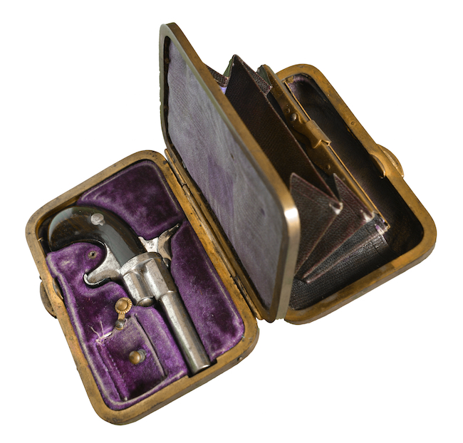 The pistol secreted in this lady's clutch was only powerful enough to frighten or wound a would-be assailant.