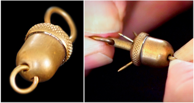 The barbs on this acorn-shaped pocket-watch fob were designed to catch on one's clothing to foil would-be thieves.