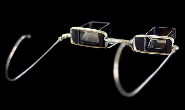 Top: The Memorandum Clock was used in lawyer's offices, and perhaps houses of ill repute, to make sure a client does not overstay his welcome. Above: Thanks to a pair of mirrors in the eyepieces, Laying Down Glasses allowed one to read a book while reclining, without even raising the book from one's lap.