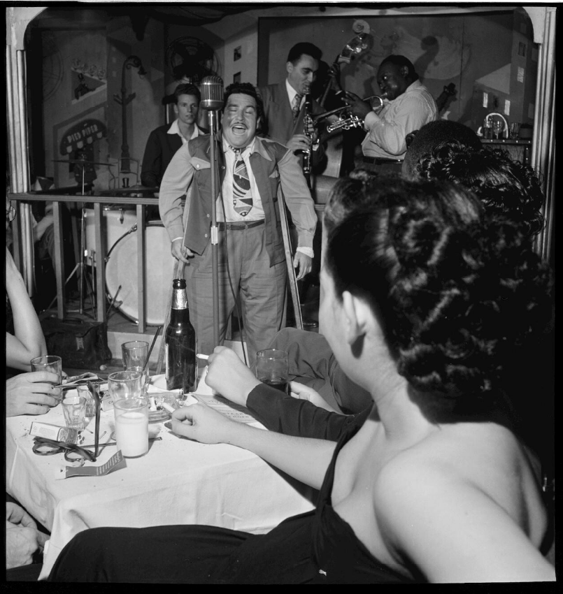 As New York City's bohemian center, Greenwich Village hosted several popular gay bars and jazz clubs in the 1940s. Here, singer Doc Pomus jams at the Pied Piper in 1947. Photo by William P. Gottlieb, via the Library of Congress.