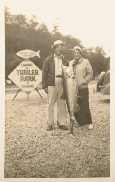 This unused tourist postcard, circa 1930-'40s, shows a couple at a so-called "fish camp." While fishing and boating were popular vacation activities, trailer parks on the water often had low-quality facilities, garnering them a bad rap. (From Don't Call Them Trailer Trash, courtesy of Schiffer Publishing)