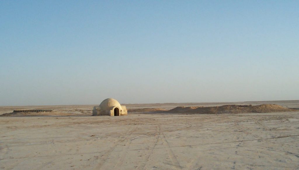 The igloo-shaped exterior of the Lars homestead was shot outside of Nefta, Tunisia, more than a 100 miles from Hotel Sidi Driss, which represented the interior of their crater. (Via Prop Store blog)