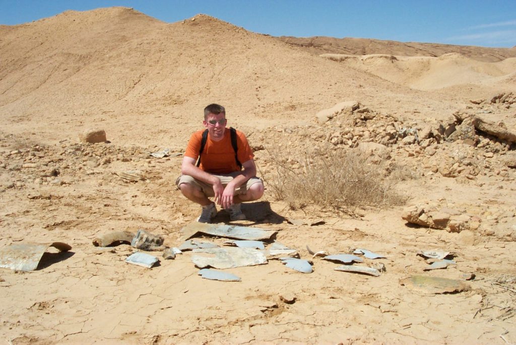 In 2001, Alinger posed with the fiberglass fragments of the Nazi Flying Wing plane seen in "Raiders of the Lost Ark." This location near Tozeur, Tunisia, represented an archaeological dig in Tanis, Egypt, in the 1981 movie. (Via Prop Store blog)