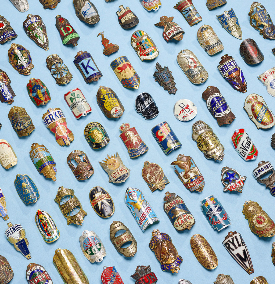 Top: A badge for the Record Cycle Company, possibly from the Netherlands. Above: A sampling of the headbadges in Conner's collection. Photo by Michael Blann for "<a href="https://rouleur.cc" target="_blank">Roleur</a>."