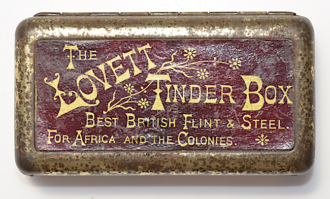 Top: In this humorous ceramic figurine, a kitten suggests that users should strike their matches on its mother's rump. Above: The Lovett Tinder Box was introduced in 1899. It sold for a shilling, mostly in South Africa.