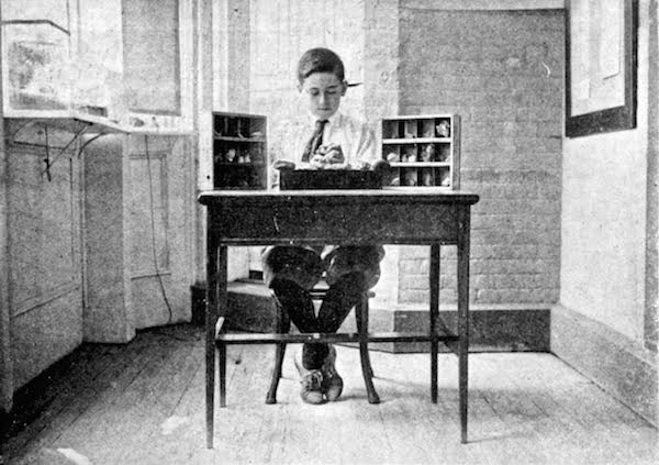George Ris identifies minerals in his collection at the Brooklyn Children's Museum, as seen in the November 1917 issue of "Children's Museum News." (From Innocent Experiments)