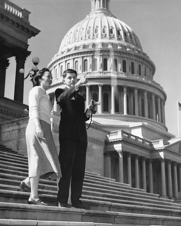 In 1954, Science Talent Search finalist Marguerite Bloom (Burlant) watches as finalist Robert Rodden points "to the future." (From Innocent Experiments, courtesy of the Society for Science & the Public)